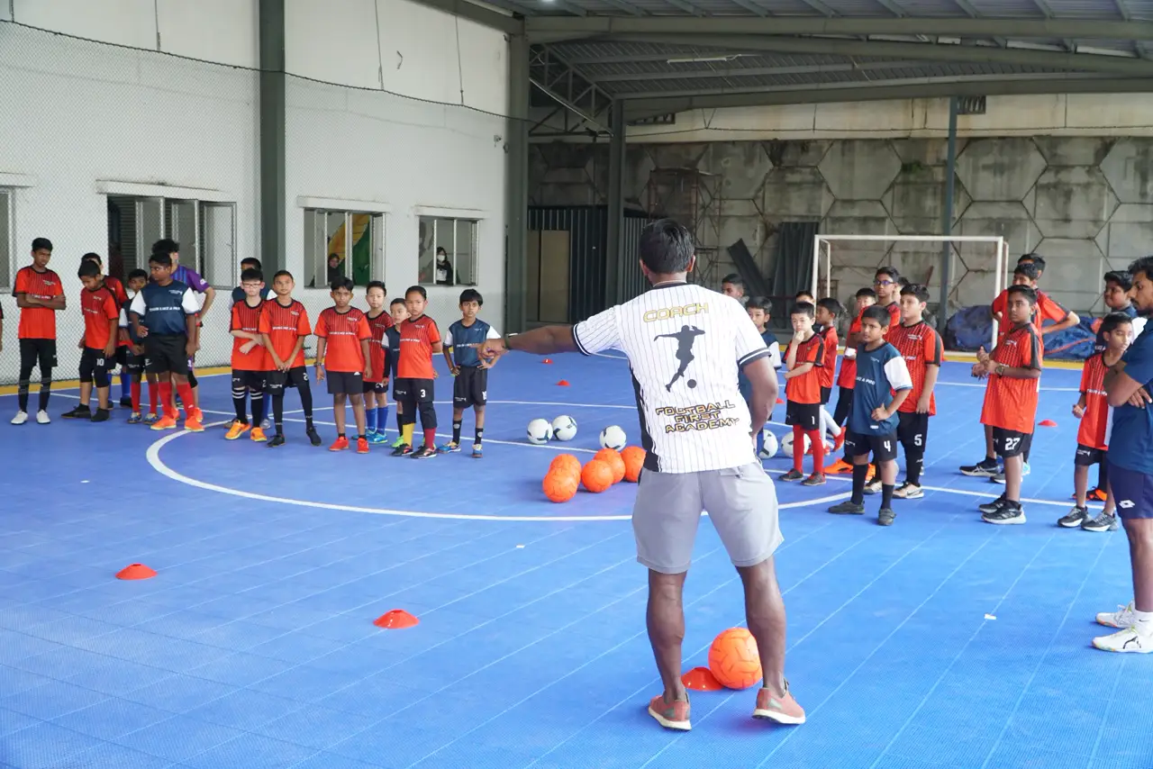 Young footballer developing skills at Football First Academy